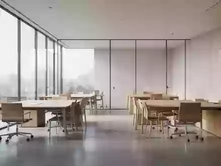Ein minimalistisches, leeres Büro mit modernen Möbeln und hellem Tageslicht. - Foto: über boerse-global.de