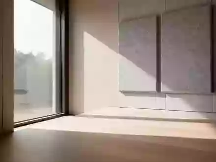 Ein minimalistisch gestalteter Raum mit sanftem Tageslicht und akustischen Wandpaneelen, der eine ruhige und klare Atmosphäre ausstrahlt. - Foto: über boerse-global.de