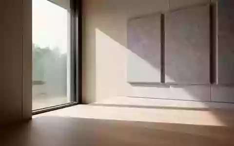 Ein minimalistisch gestalteter Raum mit sanftem Tageslicht und akustischen Wandpaneelen, der eine ruhige und klare Atmosphäre ausstrahlt. - Foto: über boerse-global.de