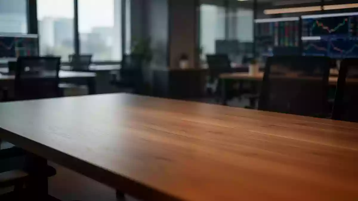 Ein leerer Schreibtisch in einem modernen Büro mit unscharfem Hintergrund, symbolisch für Unsicherheit am Aktienmarkt. Illustration mit AI erstellt.