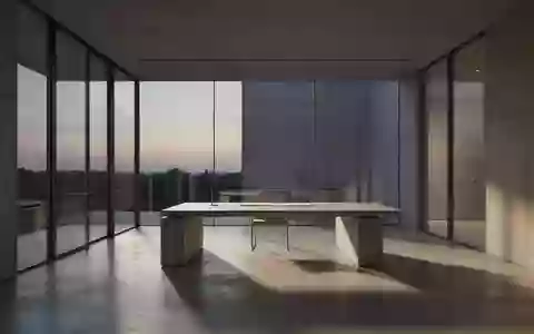 Ein minimalistischer, moderner Arbeitsbereich in einem architektonisch gestalteten Raum mit schlichten Linien und natürlichem Licht. - Foto: über boerse-global.de