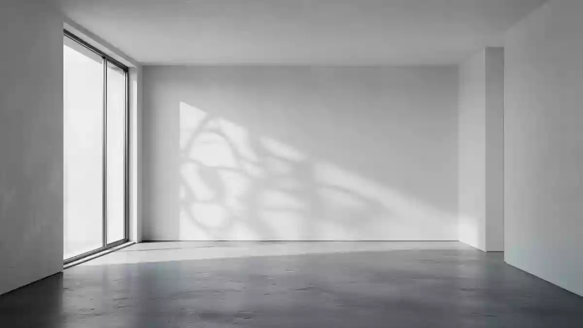 Ein minimalistisch gestalteter, leerer Raum mit poliertem Betonboden und sanftem Lichteinfall durch ein Fenster. Illustration mit AI erstellt.