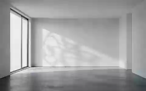 Ein minimalistisch gestalteter, leerer Raum mit poliertem Betonboden und sanftem Lichteinfall durch ein Fenster. - Foto: über boerse-global.de
