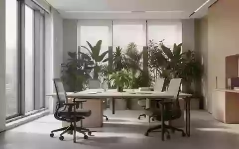 Ein heller, moderner Büroraum mit minimalistischem Design, natürlichem Tageslicht und Zimmerpflanzen. - Foto: über boerse-global.de