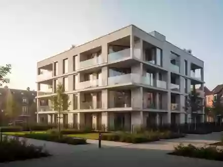 Ein neu errichtetes, modernes Wohngebäude mit hellen Fassadenelementen und Balkonen in einer städtischen Umgebung. - Foto: über boerse-global.de