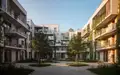Ein moderner Gemeindebau in Wien mit begrünten Fassaden und einem gepflegten Innenhof bei Sonnenuntergang. - Foto: über boerse-global.de