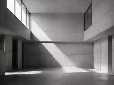 Minimalistische Architektur mit klaren Linien und Betonwänden bei natürlichem Lichteinfall. - Foto: über boerse-global.de