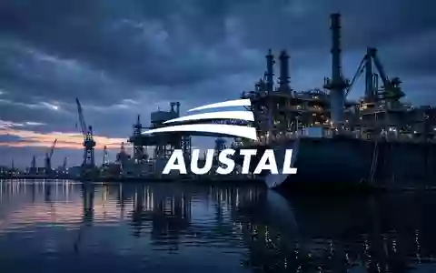 Moderne Werftanlagen bei Dämmerung, symbolisierend industrielle Zusammenarbeit und maritime Ingenieurskunst. - Foto: über boerse-global.de
