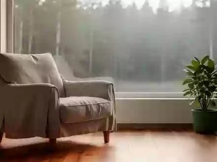 Ein ruhiger, minimalistischer Raum mit einem bequemen Sessel und natürlichem Licht, der eine Atmosphäre der Erholung ausstrahlt. - Foto: über boerse-global.de