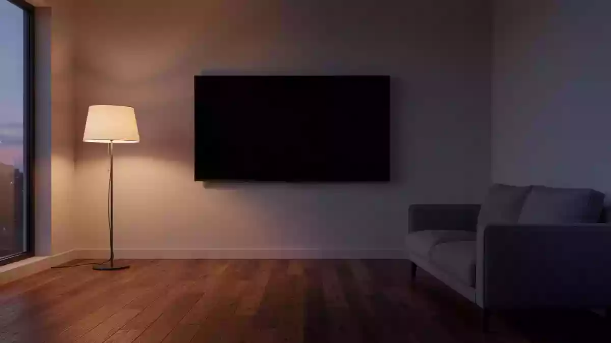 Ein minimalistisch eingerichtetes Wohnzimmer mit einem ausgeschalteten, leeren Fernsehbildschirm an einer kahlen Wand. Illustration mit AI erstellt.