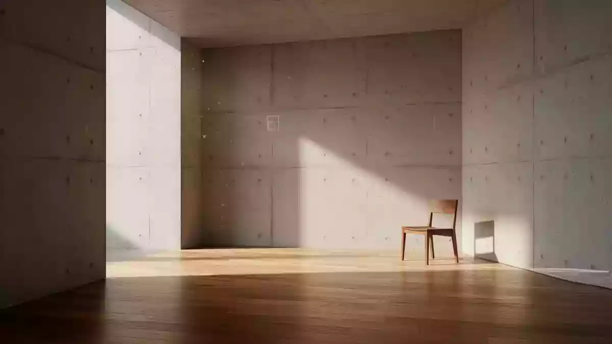 Ein minimalistischer, leerer Raum mit Betonwänden und einfallendem Sonnenlicht, der eine ruhige und technische Atmosphäre vermittelt. Illustration mit AI erstellt.