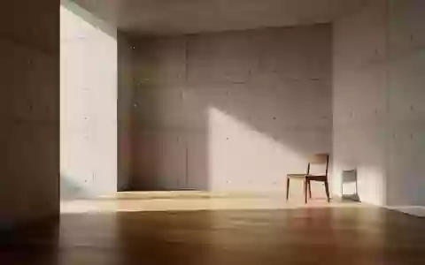 Ein minimalistischer, leerer Raum mit Betonwänden und einfallendem Sonnenlicht, der eine ruhige und technische Atmosphäre vermittelt. - Foto: über boerse-global.de