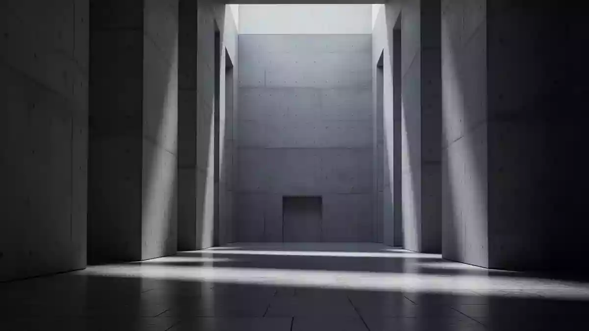 Ein minimalistischer, moderner Innenraum eines Regierungsgebäudes mit Betonwänden und langgezogenen Schatten auf einem Steinfußboden. Illustration mit AI erstellt.