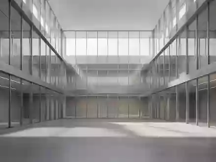 Moderne, minimalistische Architektur in einem hellen Atrium mit klaren Linien und natürlichem Lichteinfall. - Foto: über boerse-global.de