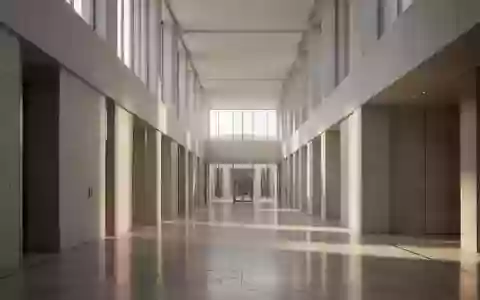 Ein minimalistischer, heller Flur in einem modernen Regierungsgebäude mit architektonischen Linien und natürlichem Lichteinfall. - Foto: über boerse-global.de
