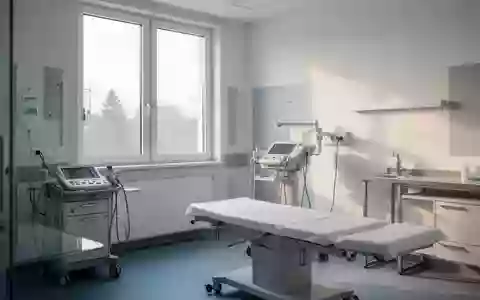 Ein heller, steriler Behandlungsraum in einer Klinik mit Fokus auf medizinischer Architektur und ruhiger Atmosphäre. - Foto: über boerse-global.de