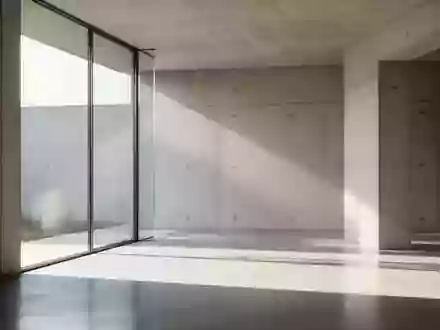 Ein minimalistischer, heller Architekturraum mit klaren geometrischen Schatten und einfallendem Tageslicht. - Foto: über boerse-global.de