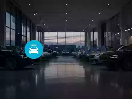 Abstrakte Darstellung eines modernen Autohauses bei Dämmerung mit Fokus auf eine professionelle, finanzielle Atmosphäre. - Foto: über boerse-global.de
