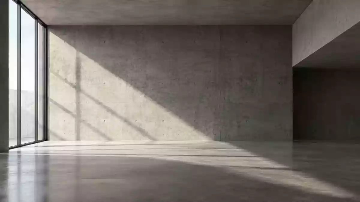Ein minimalistischer, moderner Innenraum mit klaren Linien und geometrischen Schattenwürfen auf einer Betonwand. Illustration mit AI erstellt.