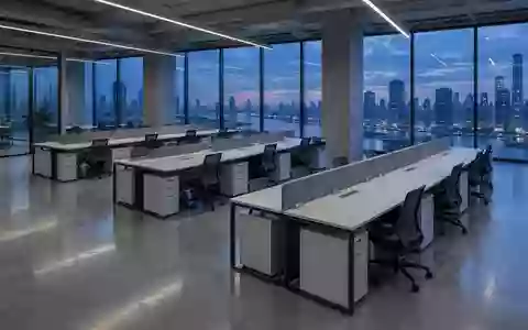 Ein minimalistisch gestaltetes, leeres Bürogebäude bei Dämmerung mit Fokus auf Architektur und Raumstruktur. - Foto: über boerse-global.de