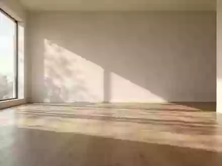 Ein minimalistischer, lichtdurchfluteter Raum mit sanften Schatten auf einem Holzboden, der Ruhe und Ausgeglichenheit ausstrahlt. - Foto: über boerse-global.de