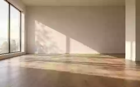 Ein minimalistischer, lichtdurchfluteter Raum mit sanften Schatten auf einem Holzboden, der Ruhe und Ausgeglichenheit ausstrahlt. - Foto: über boerse-global.de