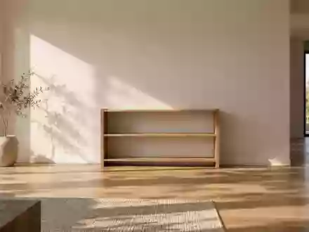 Ein minimalistisch eingerichteter, heller Wohnraum mit einem leeren Regal an einer schlichten Wand. - Foto: über boerse-global.de