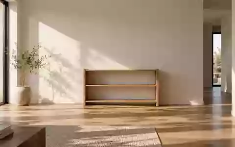 Ein minimalistisch eingerichteter, heller Wohnraum mit einem leeren Regal an einer schlichten Wand. - Foto: über boerse-global.de