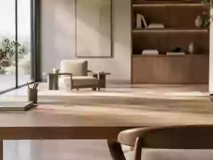 Ein minimalistischer Arbeitsbereich mit natürlichem Licht auf einer matten Holzoberfläche in einem modernen Raum. - Foto: über boerse-global.de