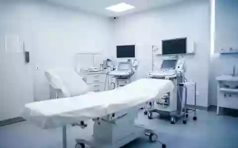 Ein klinisch eingerichteter Behandlungsraum in einer rheumatologischen Praxis mit neutralen Farben und moderner Ausstattung. - Foto: über boerse-global.de