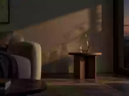 Ein minimalistisch eingerichtetes Wohnzimmer im Dämmerlicht mit einem leeren Glas auf einem Holztisch. - Foto: über boerse-global.de