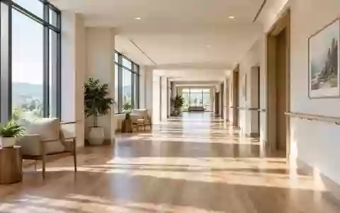 Ein heller, moderner Flur in einer Pflegeeinrichtung mit natürlichem Lichteinfall und minimalistischer Architektur. - Foto: über boerse-global.de