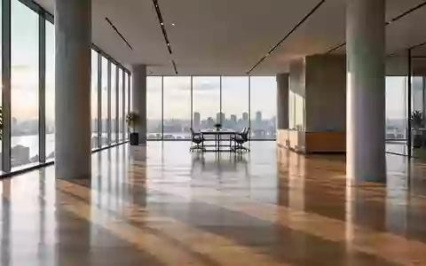 Minimalistisches, lichtdurchflutetes Bürogebäude mit klaren architektonischen Linien und polierten Holzböden. - Foto: über boerse-global.de