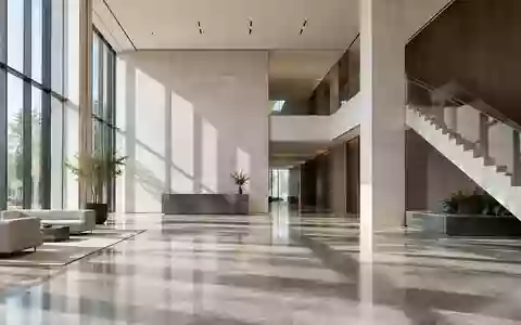 Ein minimalistisches, modernes Bürogebäude mit hohen Decken und geometrischen Linien bei natürlichem Lichteinfall. - Foto: über boerse-global.de