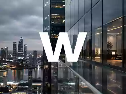 Abstrakte Aufnahme eines modernen Bürogebäudes in der Dämmerung als Symbol für den Finanzsektor. - Foto: über boerse-global.de