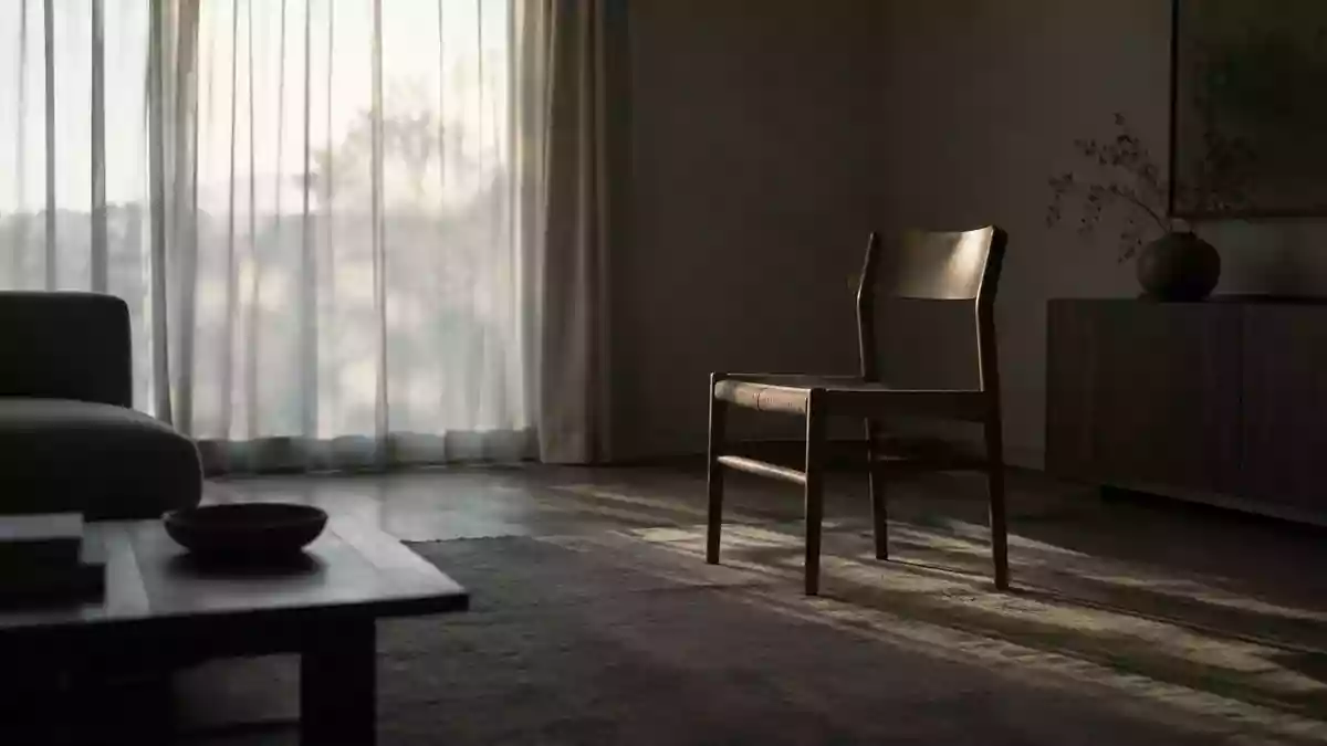 Ein minimalistisches, leerstehendes Wohnzimmer mit sanftem Lichteinfall, das eine Atmosphäre von emotionaler Distanz vermittelt. Illustration mit AI erstellt.