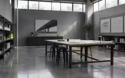 Ein minimalistischer, moderner Industrieraum mit klaren architektonischen Linien und natürlichem Licht. - Foto: über boerse-global.de
