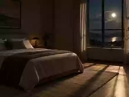 Ein minimalistisch eingerichtetes Schlafzimmer in der Nacht mit sanftem Mondlicht, das durch ein Fenster fällt. - Foto: über boerse-global.de