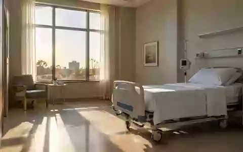 Ein ruhiges, minimalistisches Krankenzimmer mit weichem Tageslicht und einem ordentlich gemachten Bett. - Foto: über boerse-global.de
