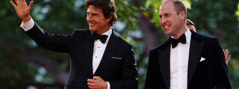 Tom Cruise (l) und Prinz William bei der zur Premiere des Films «Top Gun: Maverick». - Foto: Dan Kitwood/Getty Pool via AP/dpa