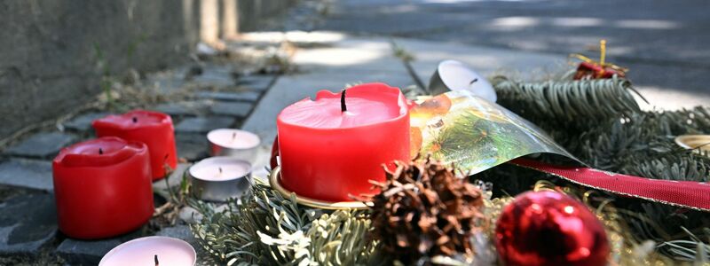 Kerzen erinnern an den Tod eines 16-jährigen Jugendlichen in Dortmund. - Foto: Bernd Thissen/dpa