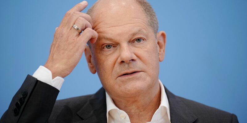 Bundeskanzler Olaf Scholz wurde bei dem Zwischenfall nicht verletzt. - Foto: Kay Nietfeld/dpa