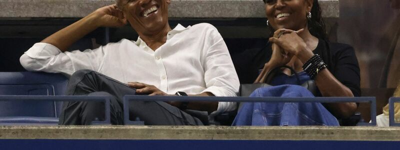 Der ehemalige US-Präsident Barack Obama und seine Frau Michelle schauen beim Tennis zu. - Foto: Jason DeCrow/AP/dpa