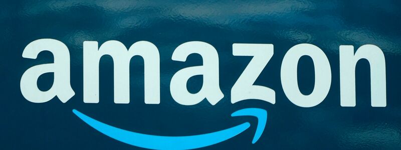 Amazon-Logo auf einem US-Lieferwagen. - Foto: Steven Senne/AP/dpa