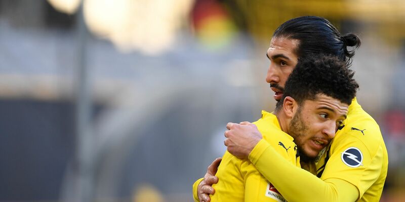 Emre Can (r) wünscht sich eine Rückkehr von Jadon Sancho zum BVB. - Foto: Marius Becker/dpa