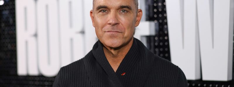 Robbie Williams feiert seinen 50. Geburtstag. - Foto: Vianney Le Caer/AP/dpa