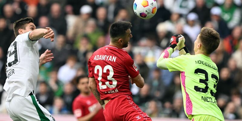 Sargis Adamyan (M) und der 1. FC Köln nehmen einen Punkt aus Mönchengladbach mit. - Foto: Federico Gambarini/dpa