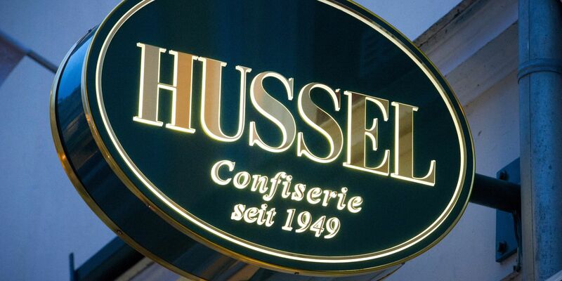 Das Logo der Confiserie «Hussel». - Foto: Stefan Sauer/dpa-Zentralbild/dpa