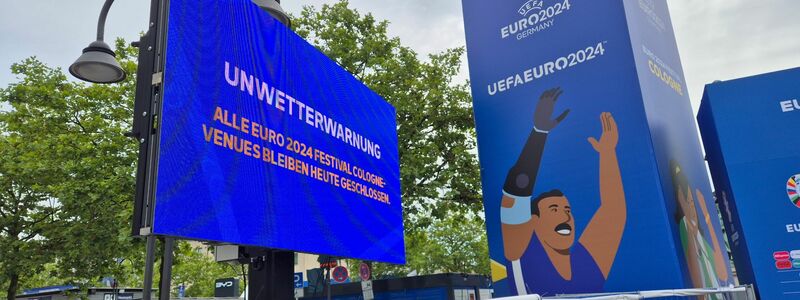 Einige Fanzonen bleiben heute wegen drohender schwerer Unwetter geschlossen. Dazu zählt auch die Fanzone in Köln. - Foto: Sascha Thelen/dpa