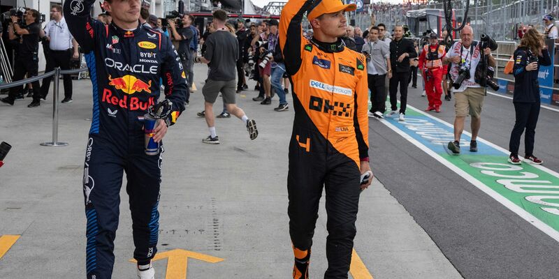 Max Verstappen (l) und Lando Norris. - Foto: Christinne Muschi/The Canadian Press via AP/dpa